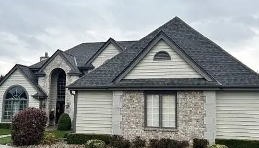 Front of home remodeled by Horizon Exteriors home renovations recent Wisconsin Rapids and Milwaukee shingles and siding installation